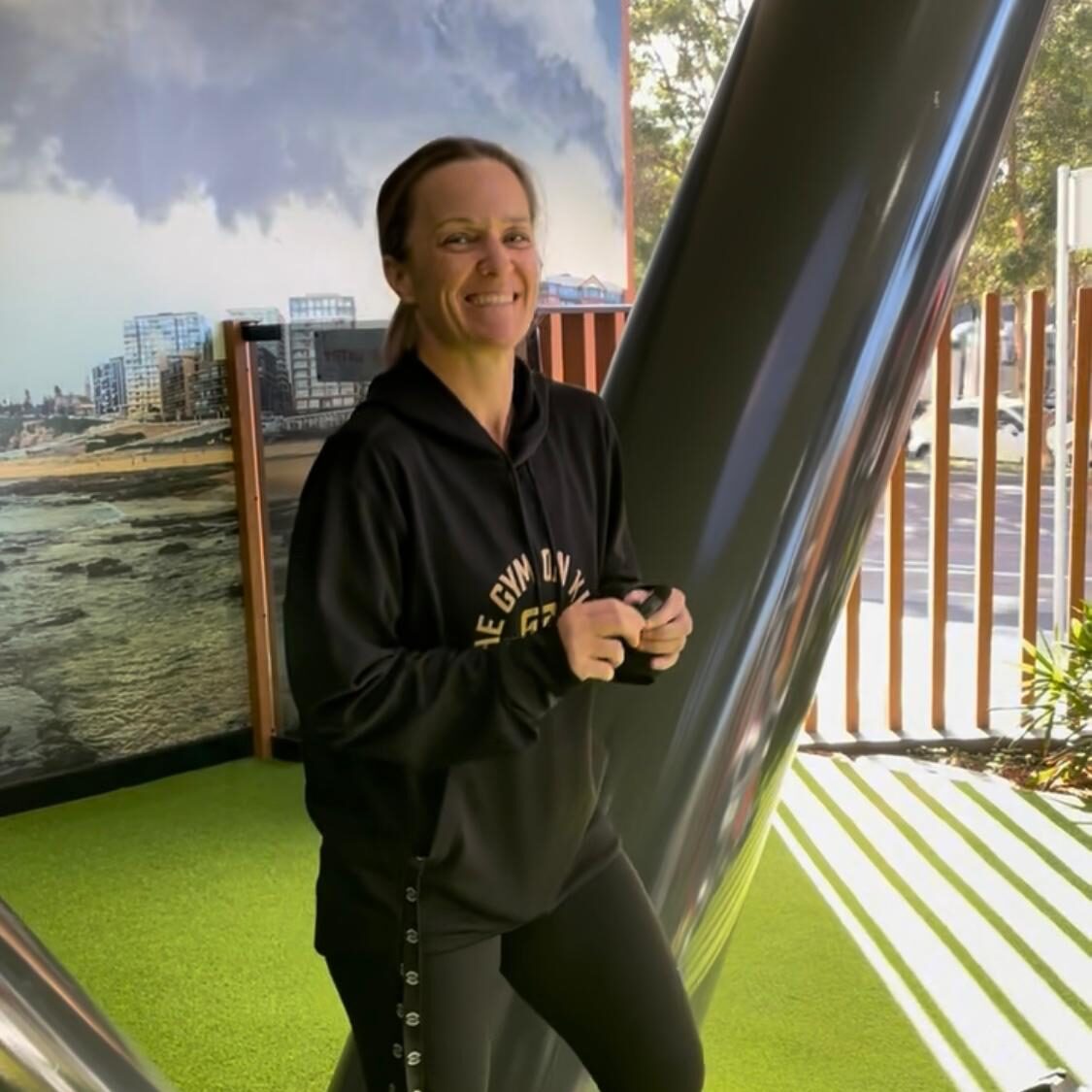 Female personal trainer, group trainer and gym manager standing in the outdoor training space